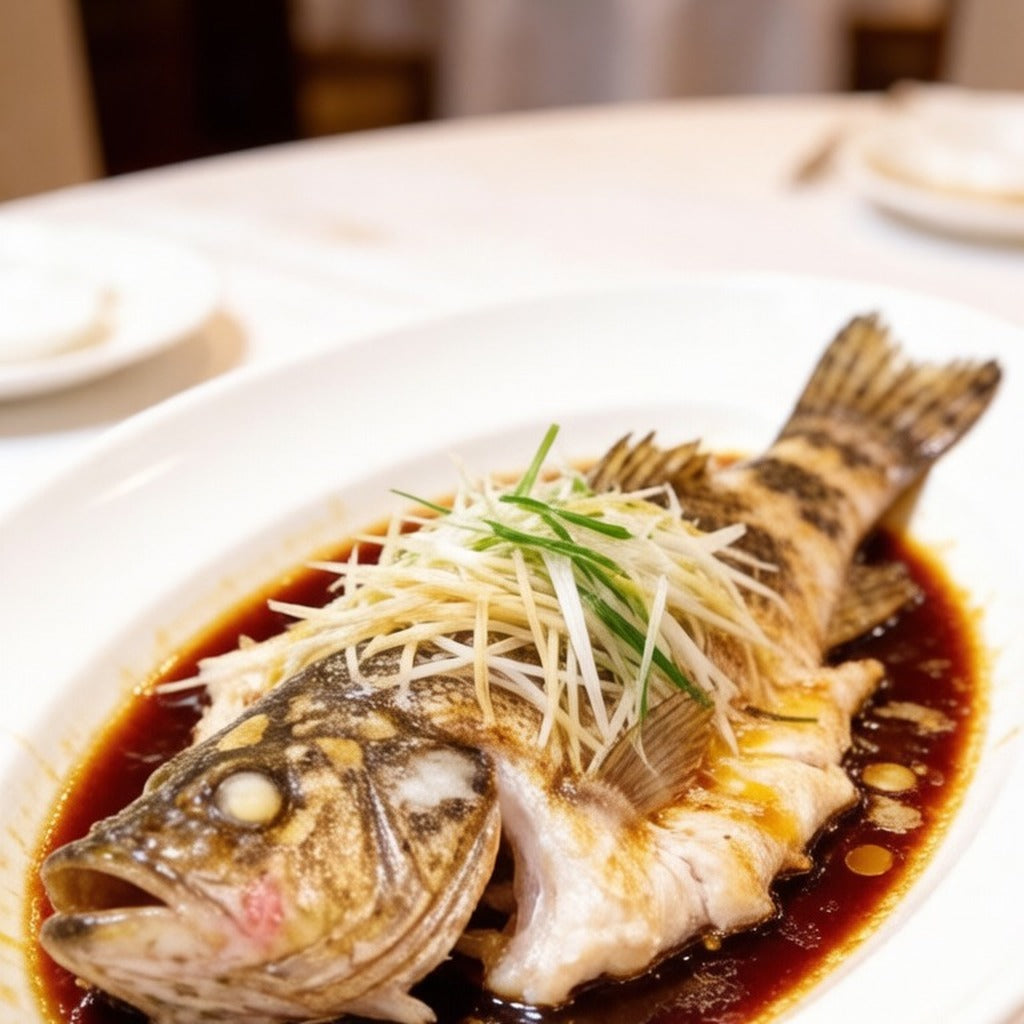 Whole steamed grouper topped with ginger and spring onion